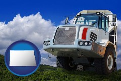 north-dakota map icon and a heavy-duty truck