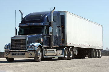 a semi trailer truck hauling long-distance freight